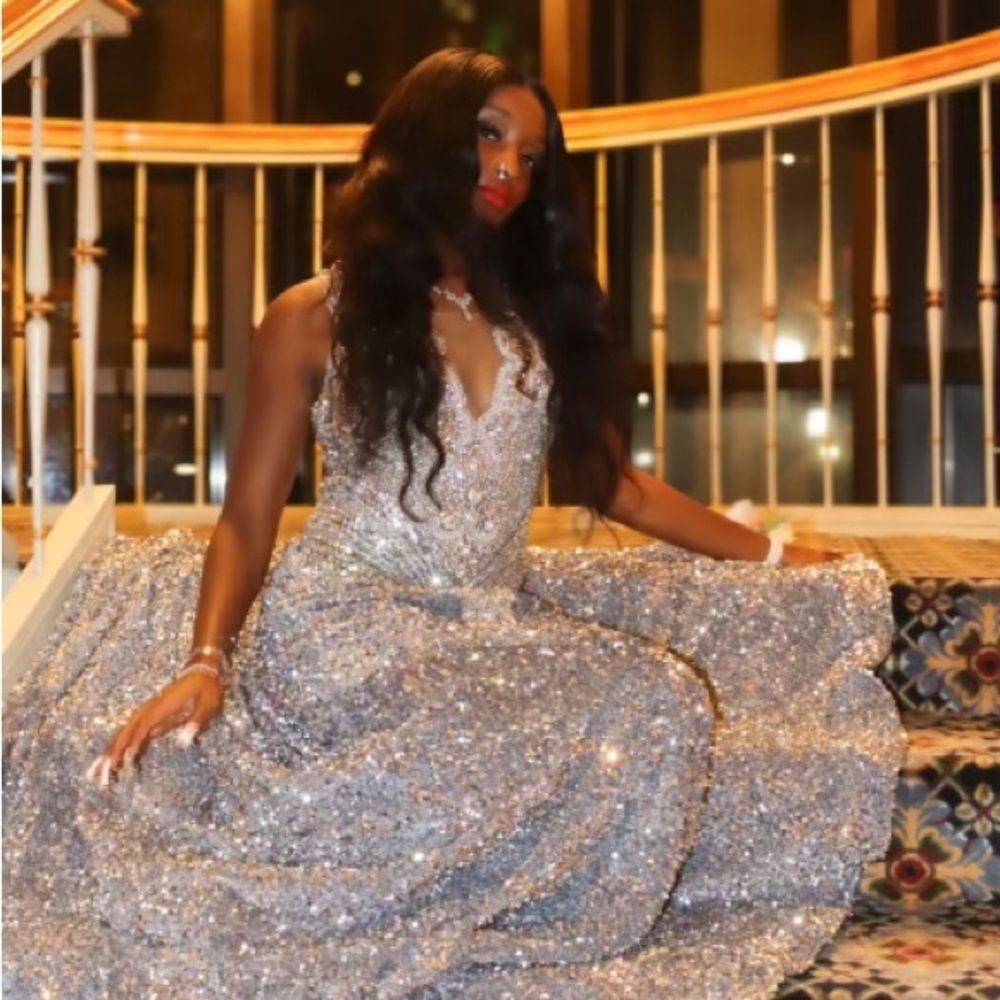 Custom prom dress. Silver mermaid silhouette.
Tight fitted. Mesh Rhinestone top.